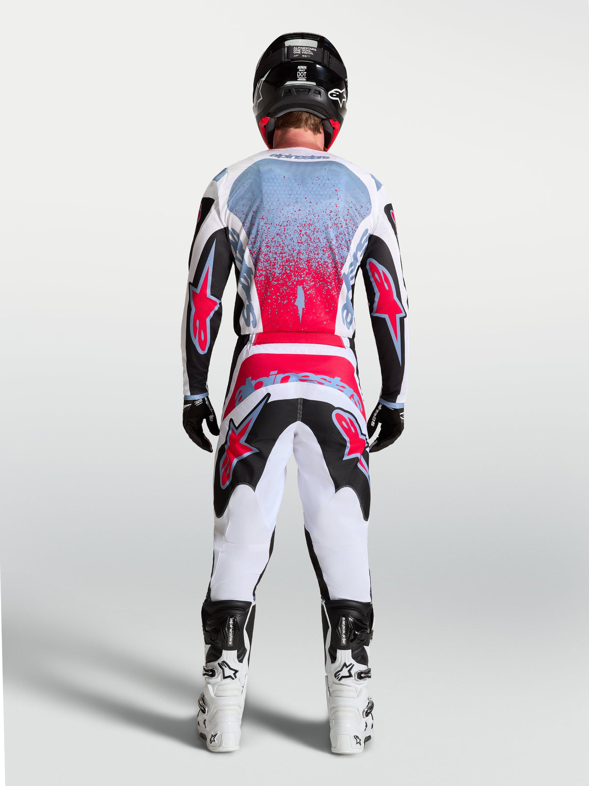 Alpinestars Fluid Drag Ausrüstungsset, Motocross-Outfit in Weiß und Rot, feuchtigkeitsableitendes Polyfabric, Rückansicht.