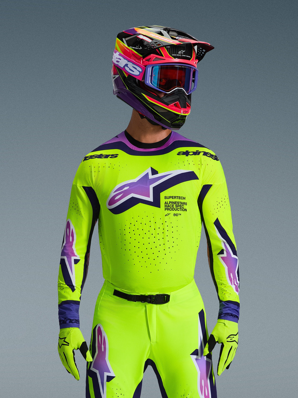 Alpinestars 2026 Supertech Vista Jersey, Motocross Jersey, Bright Neon Yellow with Purple and Black accents, worn with matching motocross helmet, goggles, and gloves, pro-level athletic fit for off-road racing