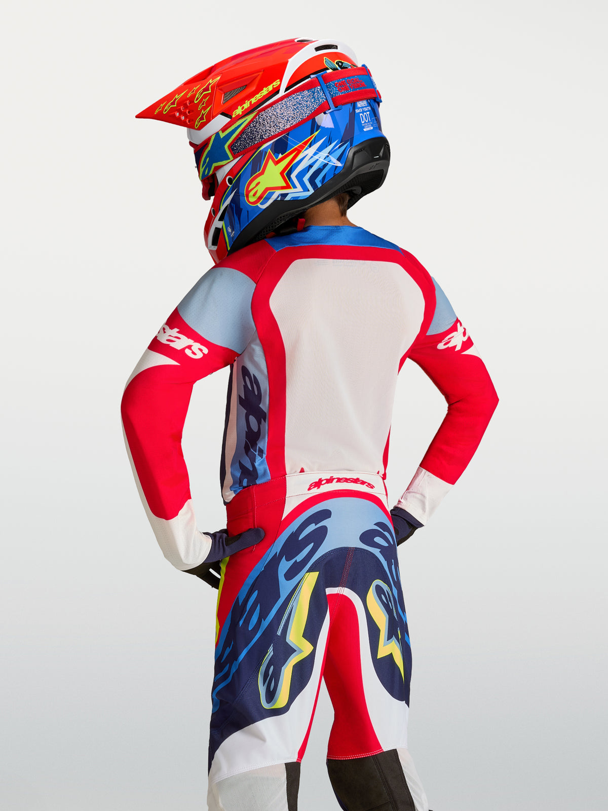 Alpinestars 2027 Youth Supertech Dyna Jersey, Motocross Racing, Red and Navy Blue, breathable mesh, rear view on rider.