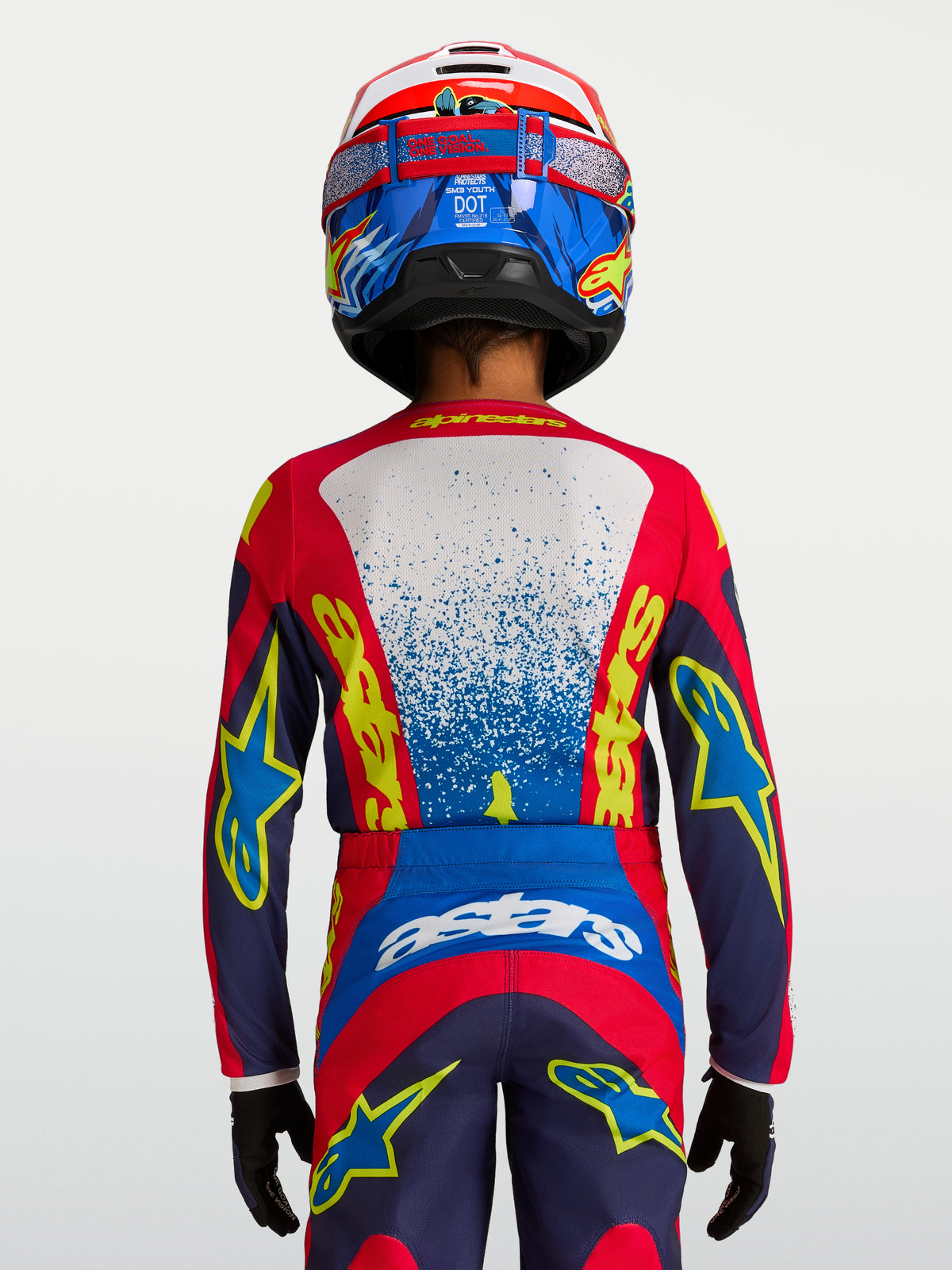 Alpinestars Youth Fluid Drag Jersey in Blue and Red, technical motocross racing top with ergonomic fit for young riders.
