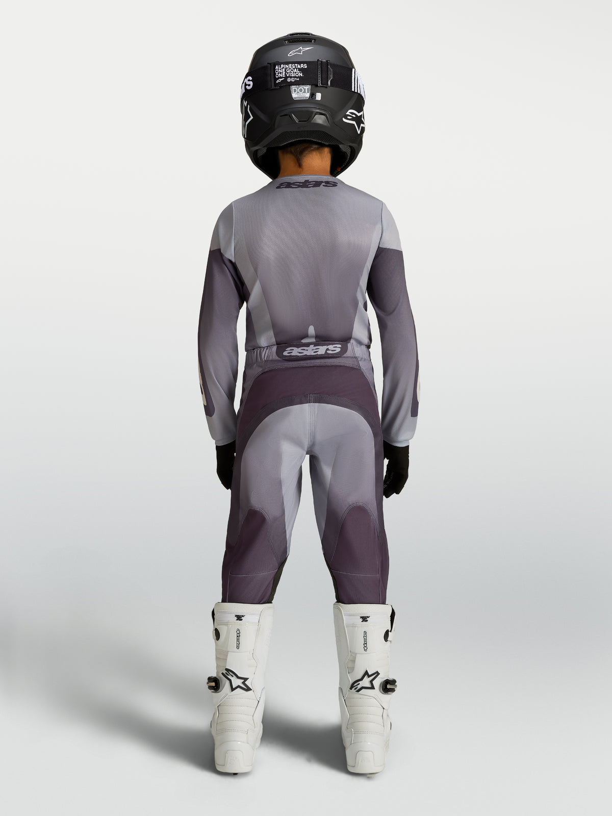 Alpinestars 2027 Youth Fluid Amber Jersey and Gear Set, gray and purple motocross racing gear, rear view on youth rider.