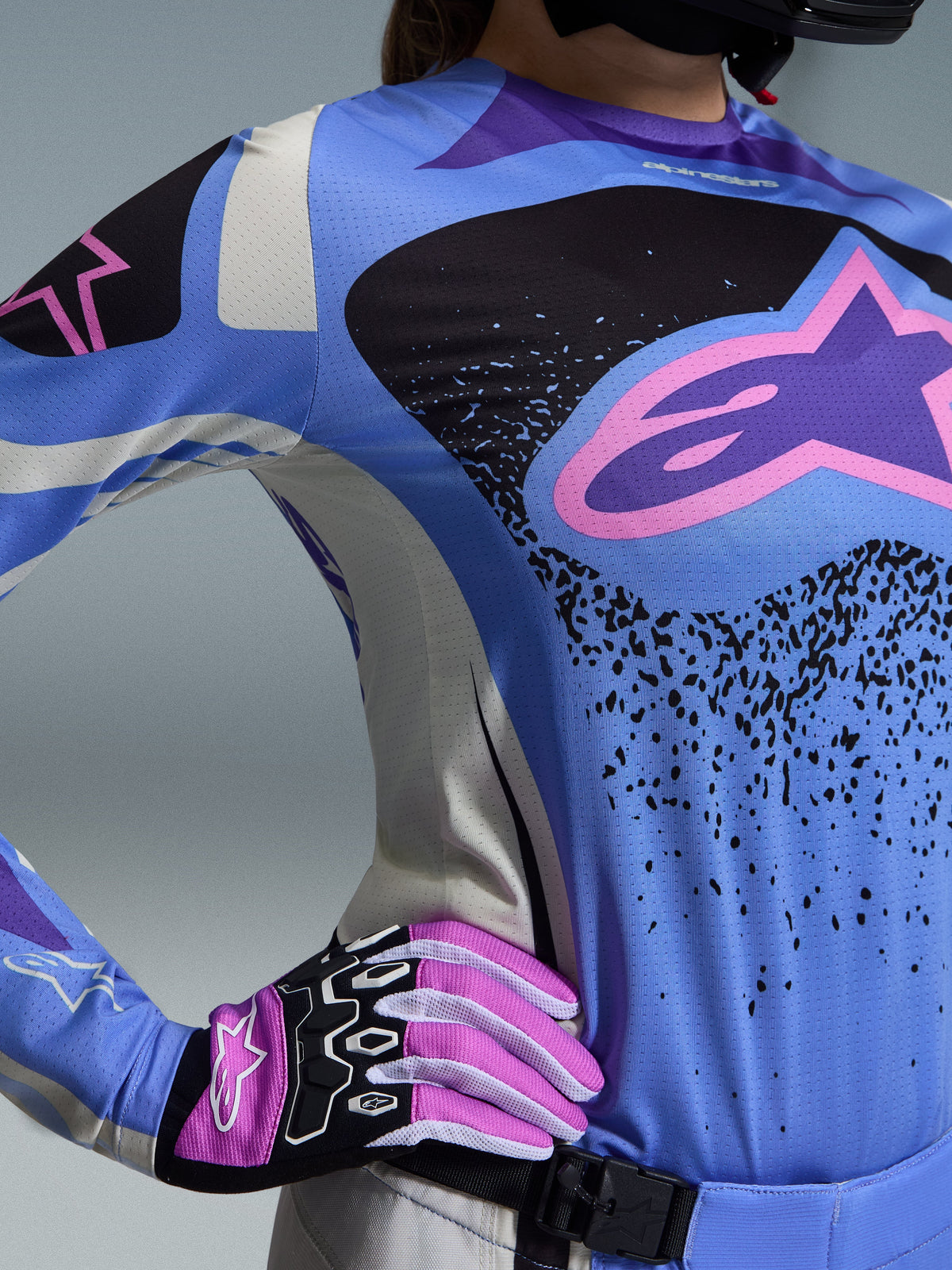 Alpinestars 2026 Stella Techstar Nomur Gear Set, Women's Motocross Gear, Light Blue and Black with pink star logo, worn with matching pink and white gloves, athletic race fit designed for elite performance on all terrain.