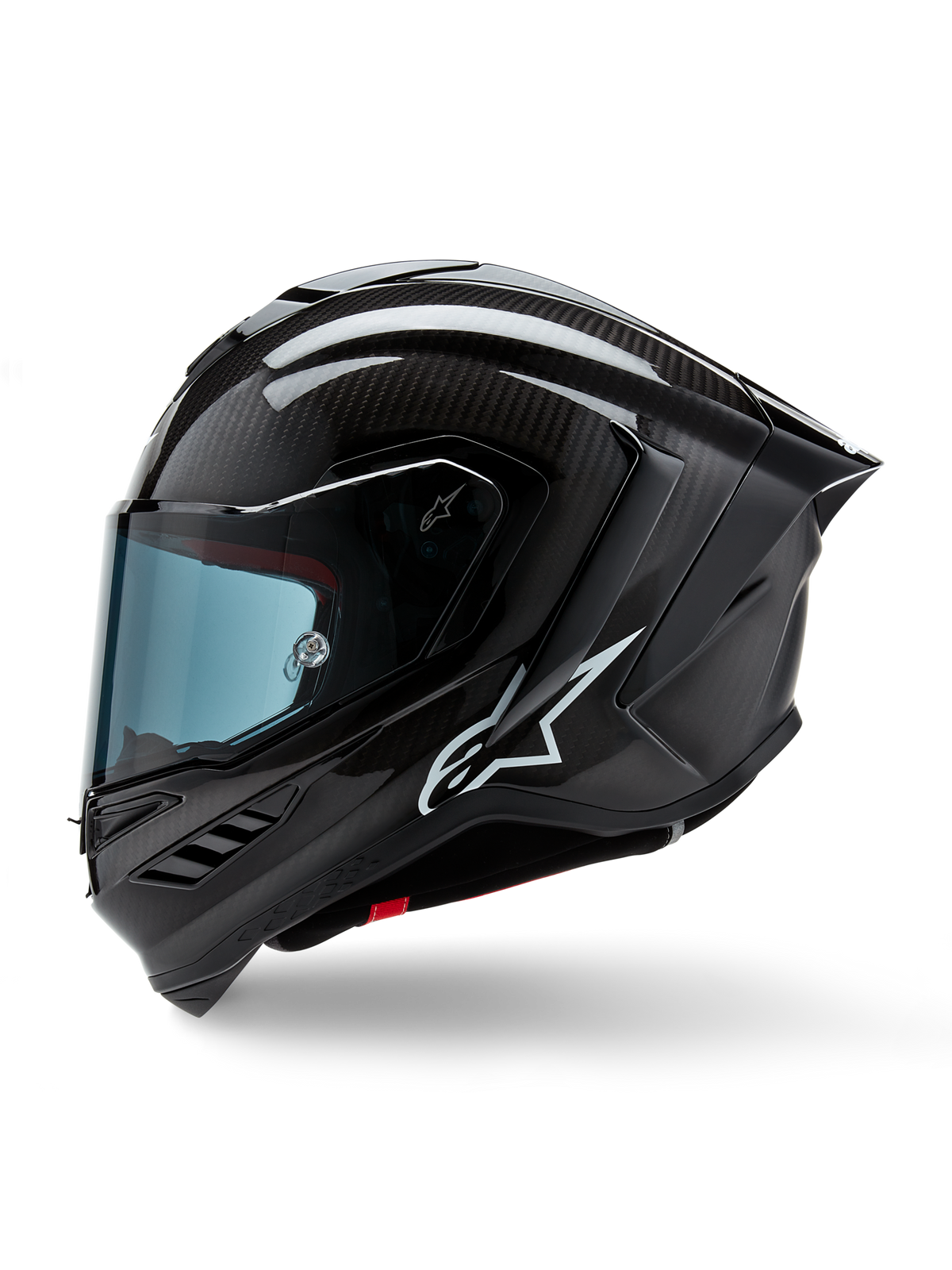 Alpinestars Supertech R10 Solid Helm, Integral-Motorradrennhelm, Schwarz Carbon Matt und Glänzend, sichtbares Carbonfaser-Webmuster, weißes Alpinestars-Logo an der Seite, aerodynamisches Design mit integriertem Heckspoiler und Belüftungsöffnungen, Seitenansicht