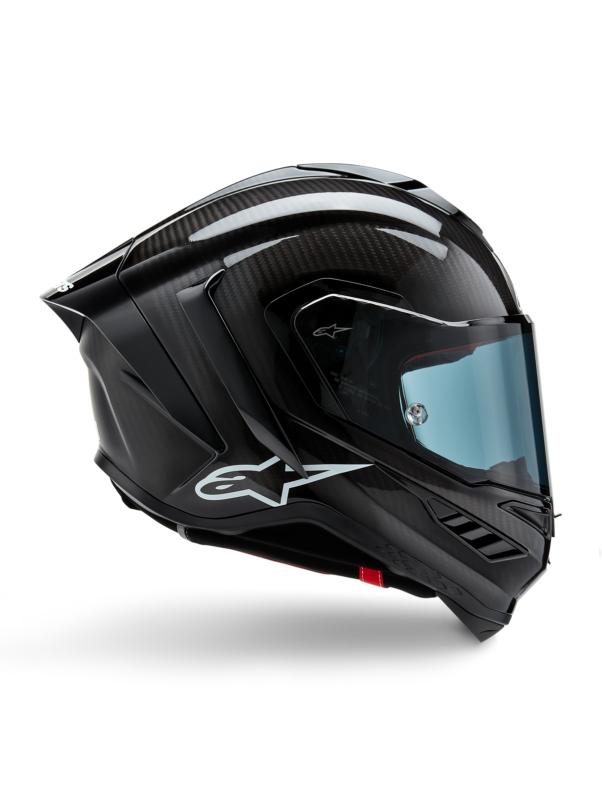 Alpinestars Supertech R10 Solid Helm, Motorrad-Rennhelm, Schwarz Carbon matt und glänzend, Carbonfaser-Konstruktion, Seitenprofil mit blau getöntem Visier, aerodynamisches Design mit Winglets, weißes Logo, High-Performance-Schutz auf MotoGP-Niveau