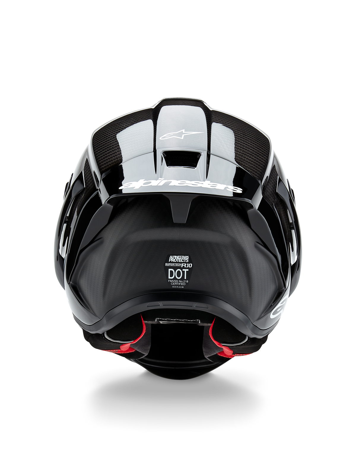 Alpinestars Supertech R10 Solid Helm, Motorradhelm, Schwarz Carbon Matt und Glänzend, Rückansicht mit Carbonfaser-Struktur, aerodynamischer Spoiler mit weißem Alpinestars-Logo, DOT- und ECE-Sicherheitszertifizierungen, rote Innenpolsterung