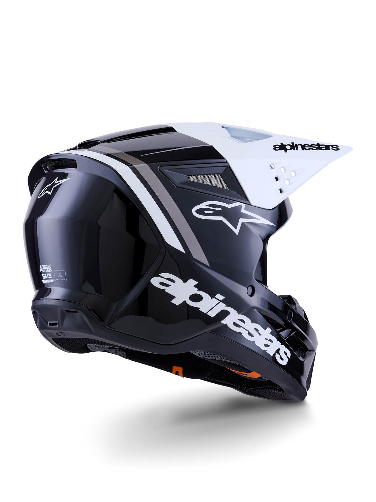 Alpinestars S-M3 Radium Helm, Motocross-Helm, Schwarz, Weiß und Grau glänzend, Rückseitenansicht mit weißem Visier, markantes Alpinestars-Logo an der Seite und hinten, aerodynamische Schale mit Belüftungsgittern, für Offroad-Motocross und Enduro konzipiert