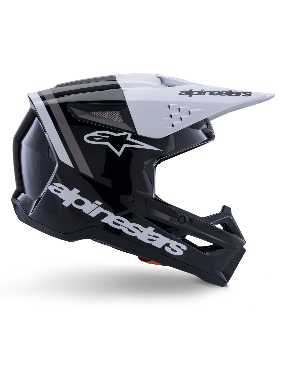 Alpinestars S-M3 Radium Helm, Motocross-Offroad-Helm, Schwarz, Weiß und Grau glänzend, mit einem kantigen aerodynamischen Design und Belüftungsöffnungen, Seitenansicht, glänzende Oberfläche mit grauen Streifen und ein weißes Visier mit Alpinestars-Branding