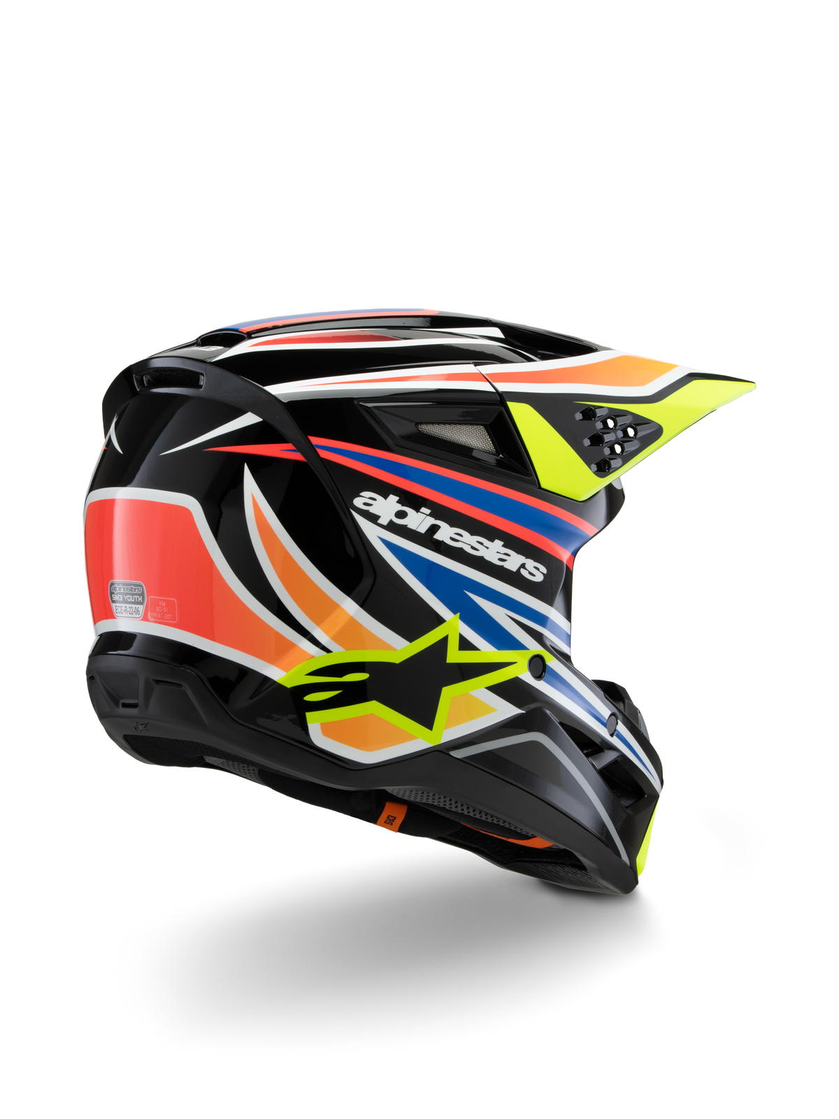 Alpinestars S-M3 Youth Wurx Helm, Jugend-Motocross-Helm, Schwarz mit leuchtend orangen, roten, blauen und fluoreszierend gelben Akzenten, Dreiviertelansicht von hinten zeigt die aerodynamische Schale und Belüftungsöffnungen, glänzendes Finish mit markantem Alpinestars-Branding.