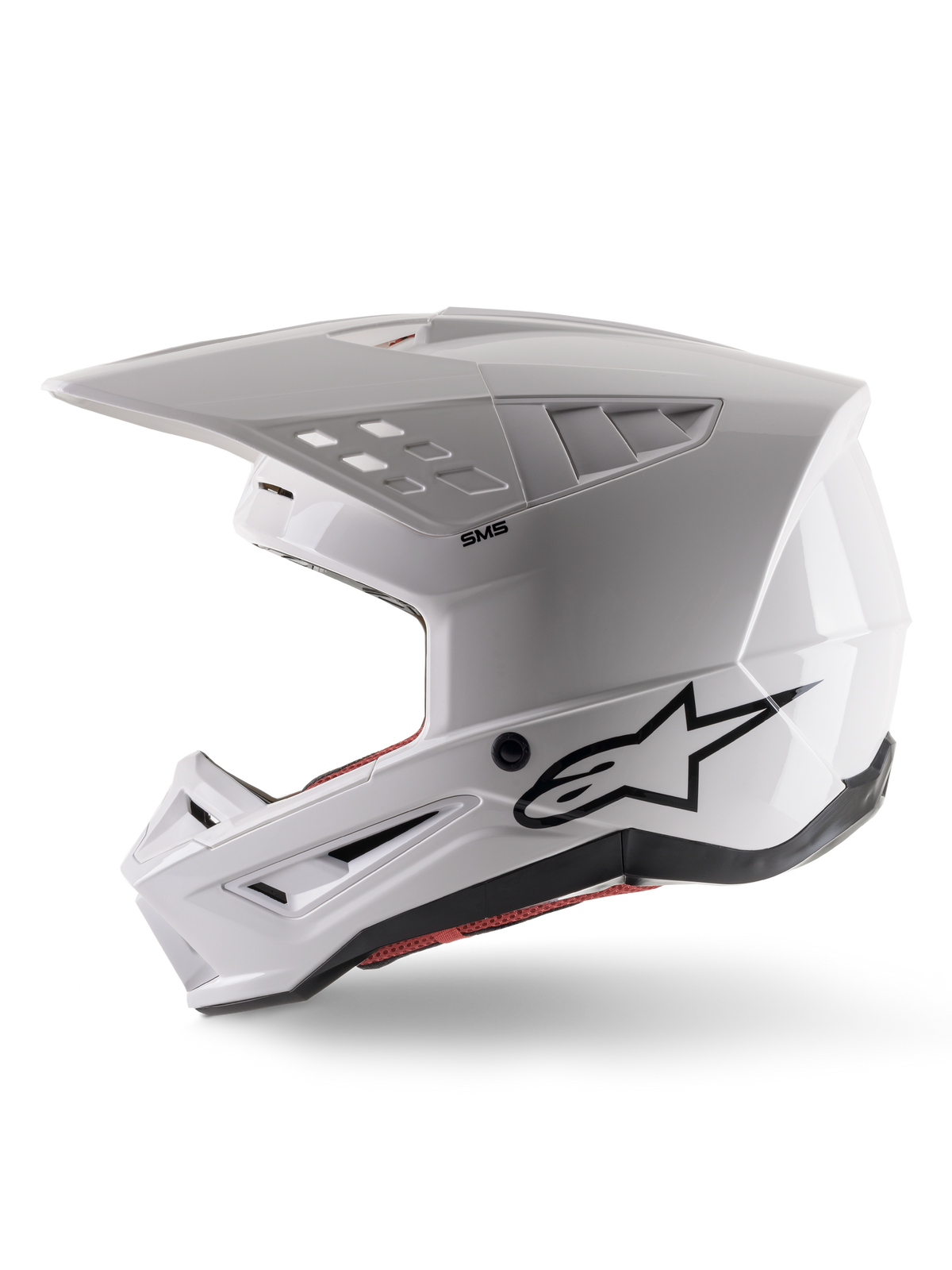 Alpinestars S-M5 Solid Helm ECE 22.06, Motocross-Helm, Weiß Glänzend, Seitenansicht mit eckigem Schalendesign, schwarzes Alpinestars-Logo an der Seite, mehrere Belüftungsöffnungen und integriertes Visier für Offroad-Rennen