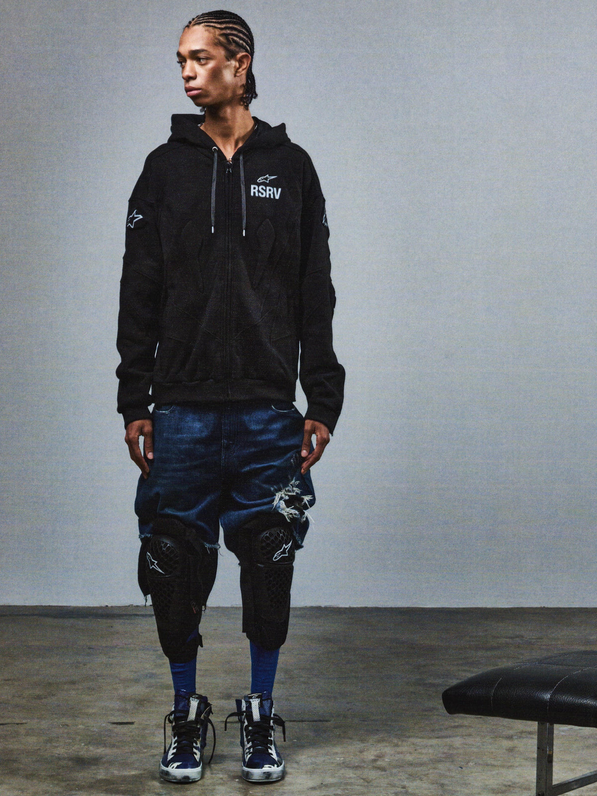 Alpinestars RSRV GP Hoodie, Black Premium Streetwear Hoodie with RSRV Logo, Lifestyle Fashion, Worn with Distressed Denim Shorts and Knee Pads, Urban Style