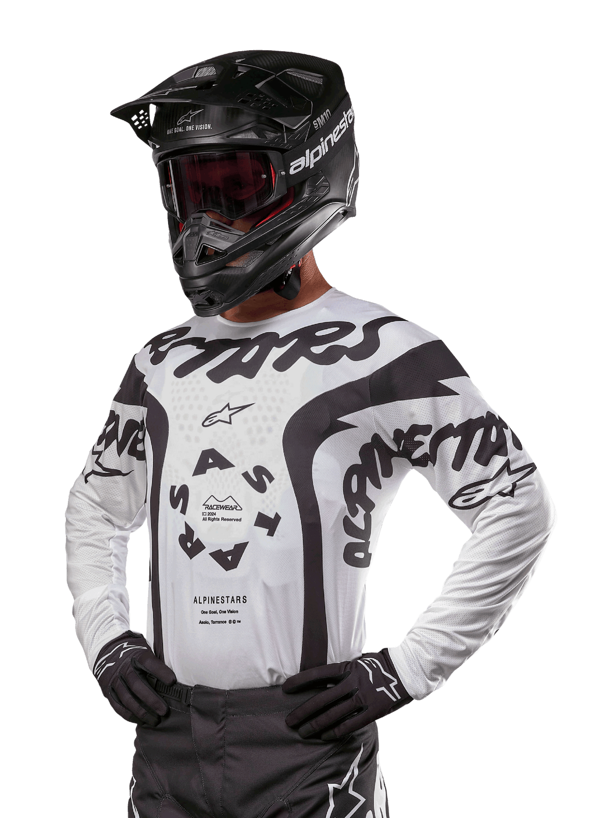 Alpinestars 2024 Racer Hana Jersey, Motocross Racing Jersey, White and Black, bold graphics with Alpinestars and Astars branding, worn with black helmet and black gloves, performance off-road MX gear