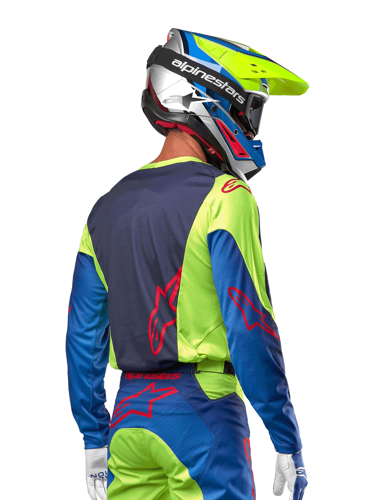 Motocross-Fahrer im Alpinestars 2024 Racer Hoen Trikot in Yellow Fluo und Blue Night Navy, mit einem roten Stern-Logo auf dem Rücken, passender Motocross-Hose und abgestimmtem Rennhelm, Rückansicht zur Darstellung des ergonomischen Designs für Offroad-Performance.