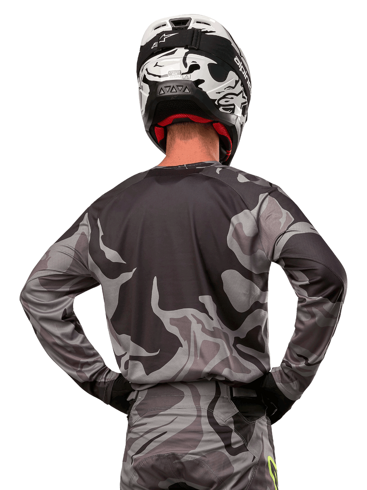 Alpinestars 2024 Racer Tactical Jersey, Motocross Jersey, Cast Gray Camo Magnet, back view showing gray and black camouflage pattern, worn with matching pants and a black and white helmet, professional off-road racing gear