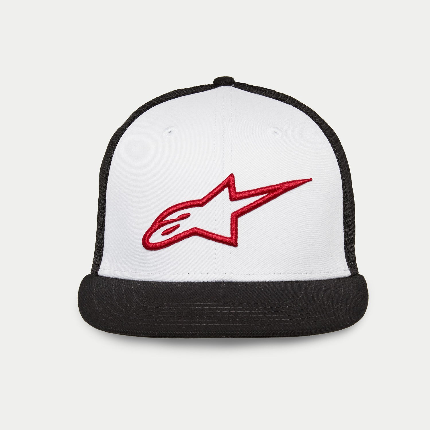 Alpinestars Corp Trucker Hat, flat bill trucker with structured crown, white front panel with black mesh back and black bill, red 3D embroidered Alpinestars logo, casual motorsport headwear