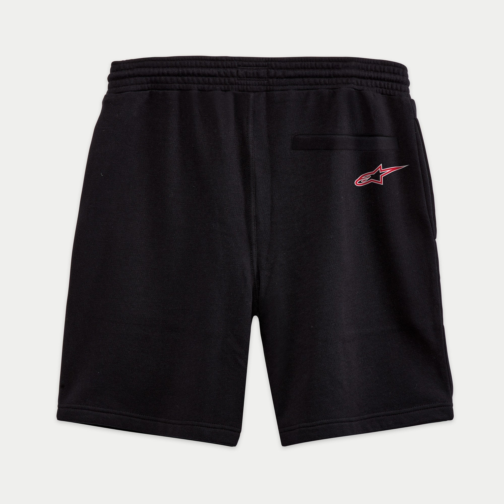 Alpinestars Dunker Short, Fleece-Shorts in Schwarz, Rückansicht mit rotem Logo-Detail auf der hinteren Hüfte, elastischer Bund und hintere Leistentasche, komfortable Freizeit- und Sportbekleidung.