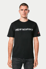 Alpinestars Linear Wordmark 2.0 CSF Tee, Black short-sleeve T-shirt, grey Alpinestars wordmark on chest, red Ageless logo on sleeve, worn by model with dark jeans, casual motorsport streetwear