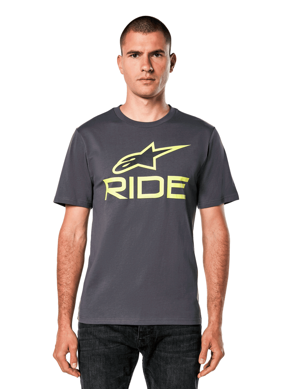 Alpinestars Ride 4.0 CSF Tee, casual motorcycle t-shirt, dark gray with yellow logo, short sleeve crew neck, worn with dark jeans against black background