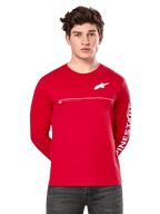 Alpinestars Committed CSF Long Sleeve Tee, Red, worn by a model, featuring white Astars chest logo and Alpinestars sleeve graphic, horizontal white chest line, casual motorsport-inspired streetwear