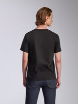 Alpinestars Luxo CSF Tee, Short Sleeve T-Shirt, Black, back view, worn by a model with dark blue jeans, casual motorsport-inspired streetwear