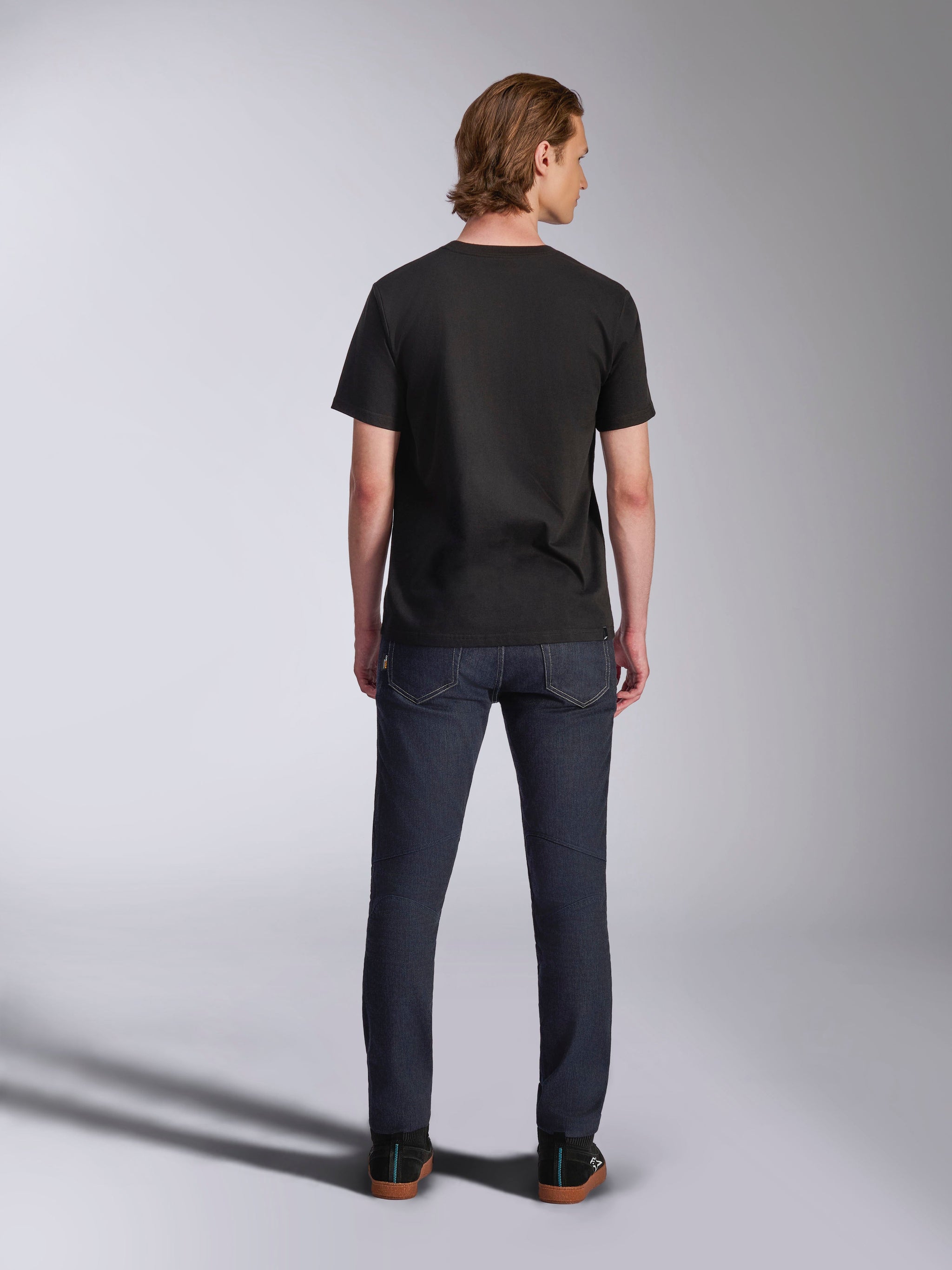 Alpinestars Luxo CSF Tee, Short Sleeve T-Shirt, Black, Back View, worn by model with dark denim pants, Casual Motorsport Streetwear