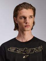 Alpinestars Luxo CSF Tee, Short Sleeve T-Shirt, Black, Gold metallic Astars chest logo, worn by male model, casual motorsport-inspired design
