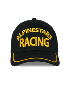 Alpinestars Luminary Kappe, schwarze Snapback-Cap, gelbe 3D-Stickerei „Alpinestars Racing“ auf der Vorderseite, gebogener Schirm mit gelbem Sutache-Besatz, lässige Motorsport-Kopfbedeckung