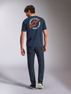 Alpinestars Aorbit CSF Tee, Short Sleeve T-Shirt, Navy, back view on model featuring large circular graphic with red Astars logo and 'Always Fast Made to Last' text, casual motorsport streetwear