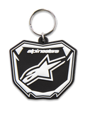 Alpinestars Plate Keyfob, 3D molded keychain, Black and White, featuring Astars MX plate graphic with white logo and text, silver metal snap ring, motorsport-inspired accessory