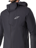 Alpinestars A-Dura Elite wasserdichte Jacke, MTB-Fahrradjacke, Schwarz, mit einer 3-lagigen wasserdichten Membran, über den Helm passender Kapuze, Reißverschlusstaschen und technischer Ripstop-Textur für Mountainbike-Trail-Fahrten