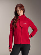 Alpinestars Stella A-Dura Elite Wasserdichte Jacke, Damen-Mountainbike-Jacke, Red Fluo, mit einer vorderen Frontklappe mit weißem Alpinestars-Logo, hohem Kragen und verstellbaren Ärmelbündchen, getragen mit einer schwarzen Hose für einen technischen Riding-Look