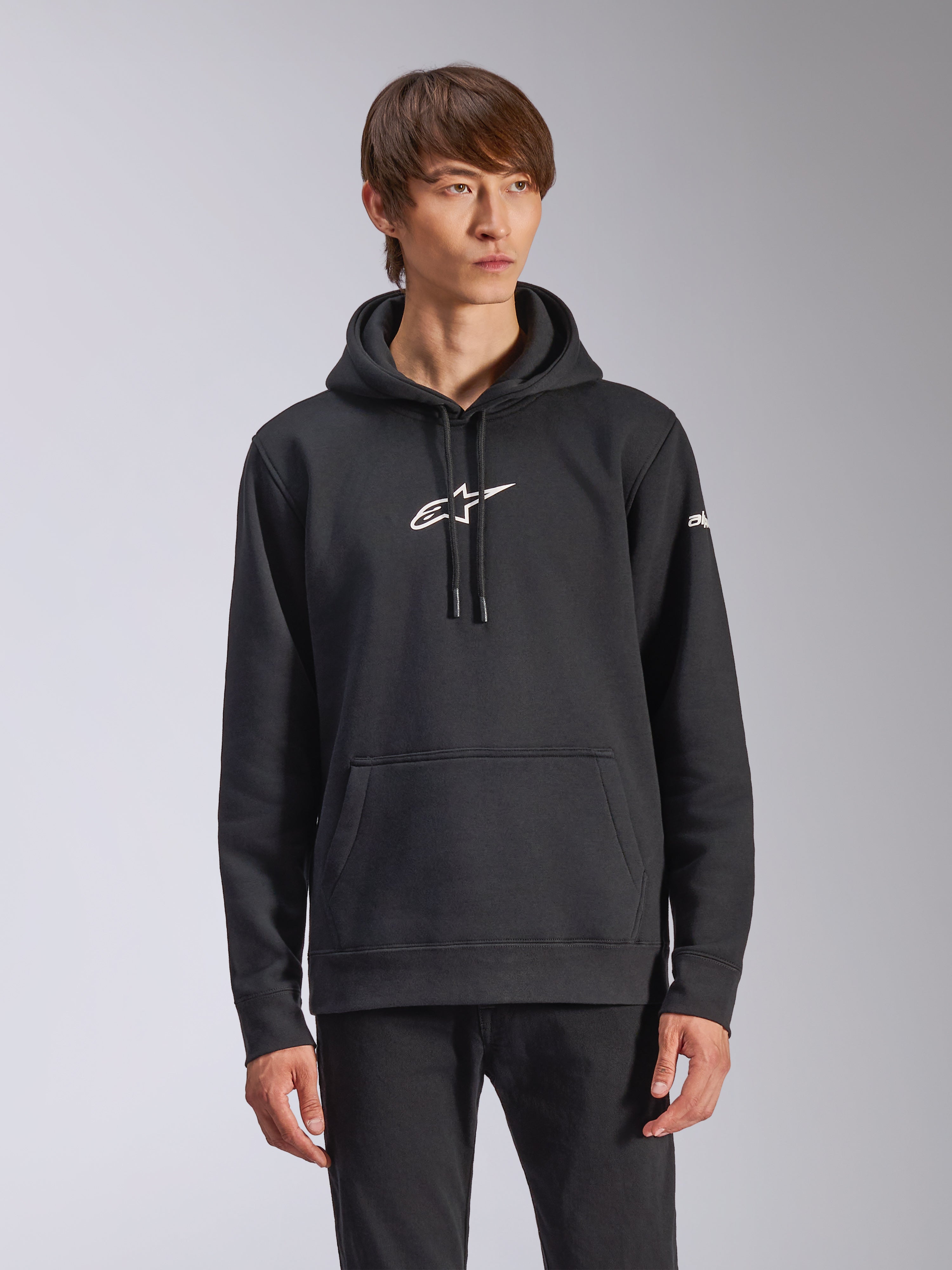 Alpinestars Frontal Hoodie, Black pullover fleece hoodie, white Alpinestars logo on chest, white wordmark on sleeve, kangaroo pocket, casual motorsport streetwear