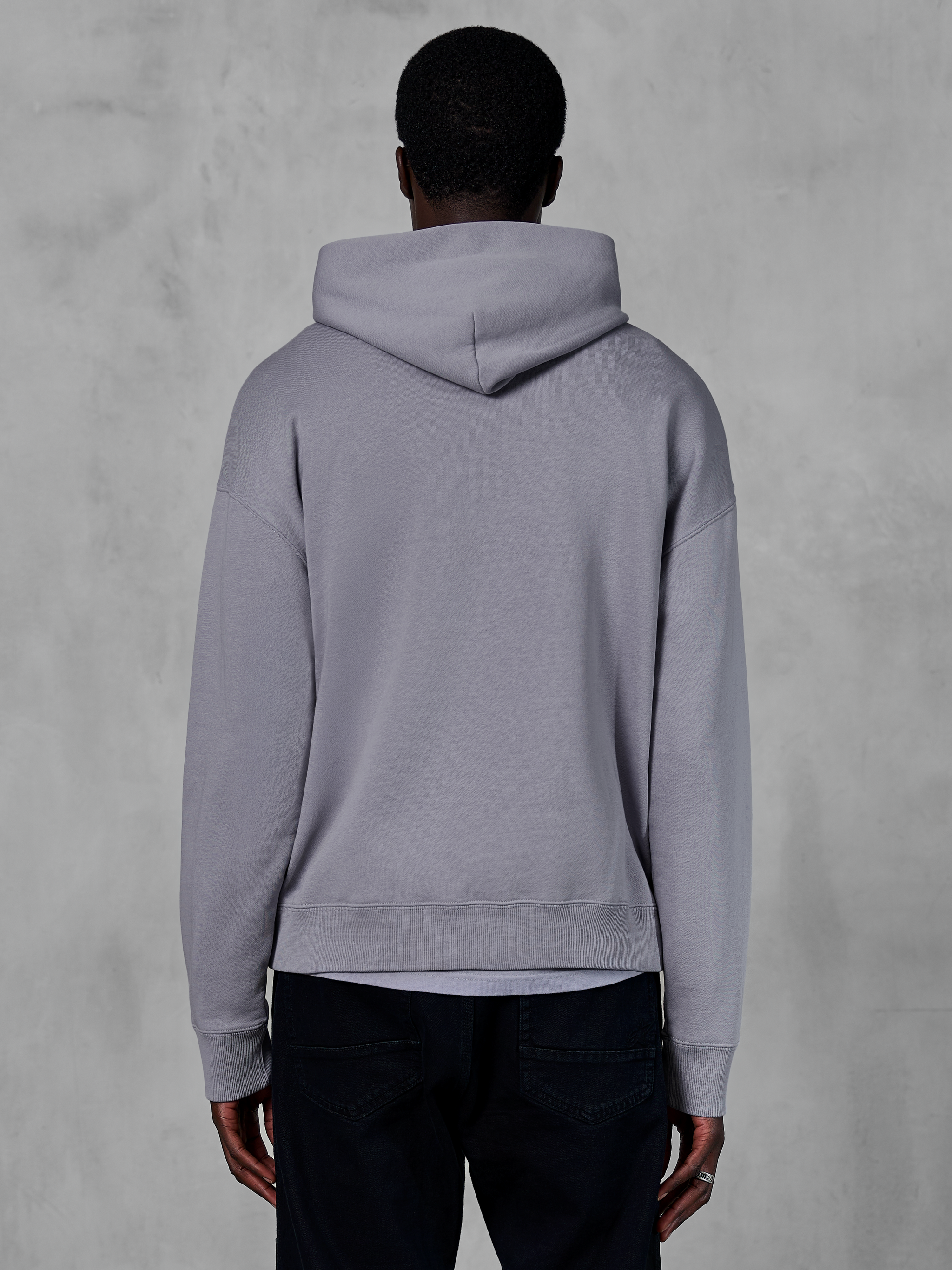 Alpinestars Essentials Ageless Hoodie, silver grey fleece, back view, featuring a minimalist pullover design with a hood and ribbed cuffs, casual motorsport-inspired streetwear