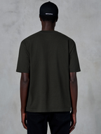 Alpinestars Essentials Ageless SS Tee, Back view of a short-sleeve T-shirt, Off Black, organic cotton jersey with a relaxed fit, casual motorsport-inspired streetwear paired with a black logo cap
