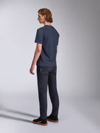 Alpinestars Fasting CSF Tee, Short Sleeve T-Shirt, Navy Blue, back view on model, paired with dark denim pants and black sneakers, casual motorsport-inspired streetwear