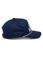 Alpinestars Ride Comp Snapback Hat, Navy Blue with White and Red accents, side profile view showing curved bill and white braided rope trim, structured crown, casual motorsport headwear