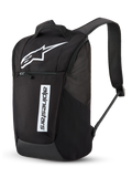 Alpinestars Defcon V3 Backpack, Daily Backpack, Black and White, featuring a large white Astar logo and vertical Alpinestars wordmark, front zippered pocket, padded air-mesh shoulder straps, durable 600D polyester, casual motorsport-inspired design