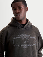 Alpinestars Infinite Washed Oversized Hoodie, Herren-Kapuzenpullover, Sportswear Pullover in Schwarz mit Snow-Wash-Finish, Fleece-Material, gestickte Alpinestars Wortlogos und One Goal One Vision Grafik, lässiger Oversized-Schnitt für den Alltag.