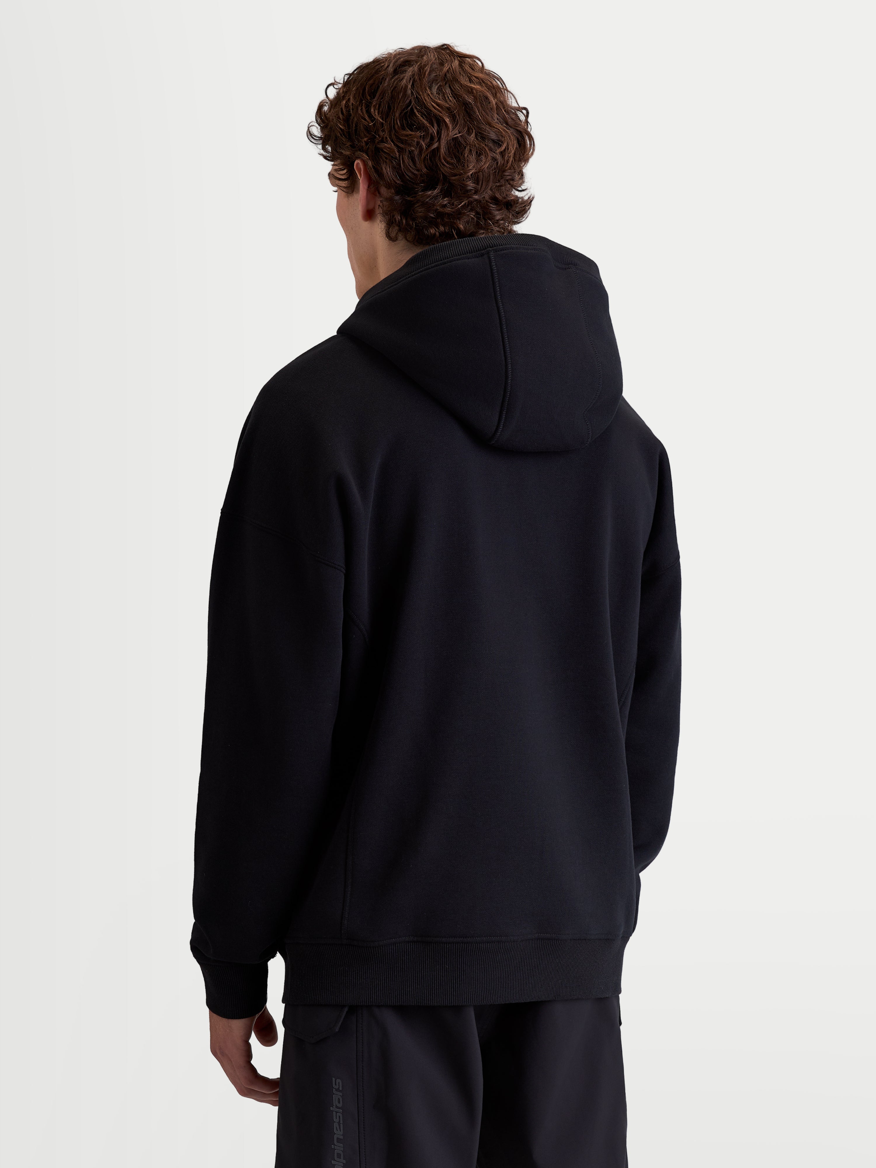 Alpinestars Shaw Oversize-Hoodie, Sportswear-Pullover für Herren und Damen, Schwarz, Rückansicht mit entspannter Oversize-Passform, weiches Fleece aus Baumwolle und recyceltem Polyester mit Rippbündchen.
