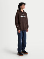 Alpinestars Prelude Oversized Hoodie, brauner Sportswear-Kapuzenpullover für Herren, mit weißen Alpinestars Puff-Print-Logos auf der Brust und am Ärmel, Kängurutasche, Oversized-Passform, Braun und Weiß, hochwertige Fleece-Konstruktion.