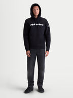 Alpinestars Race Wordmark Hoodie, Herren-Kapuzenpullover aus Fleece, Schwarz und Weiß, mit weißem Race Linear Word Logo auf der Brust und Ageless-Ärmellogo, Kapuze und Kängurutasche, Motorsport-Lifestyle-Sportswear.