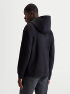Alpinestars Entity Oversized Hoodie, Sportswear Zip Fleece, Black, Oversized Fit, Rear View on Model, Self-Lined Hood and Ribbed Trims, Premium Cotton and Recycled Polyester Blend.