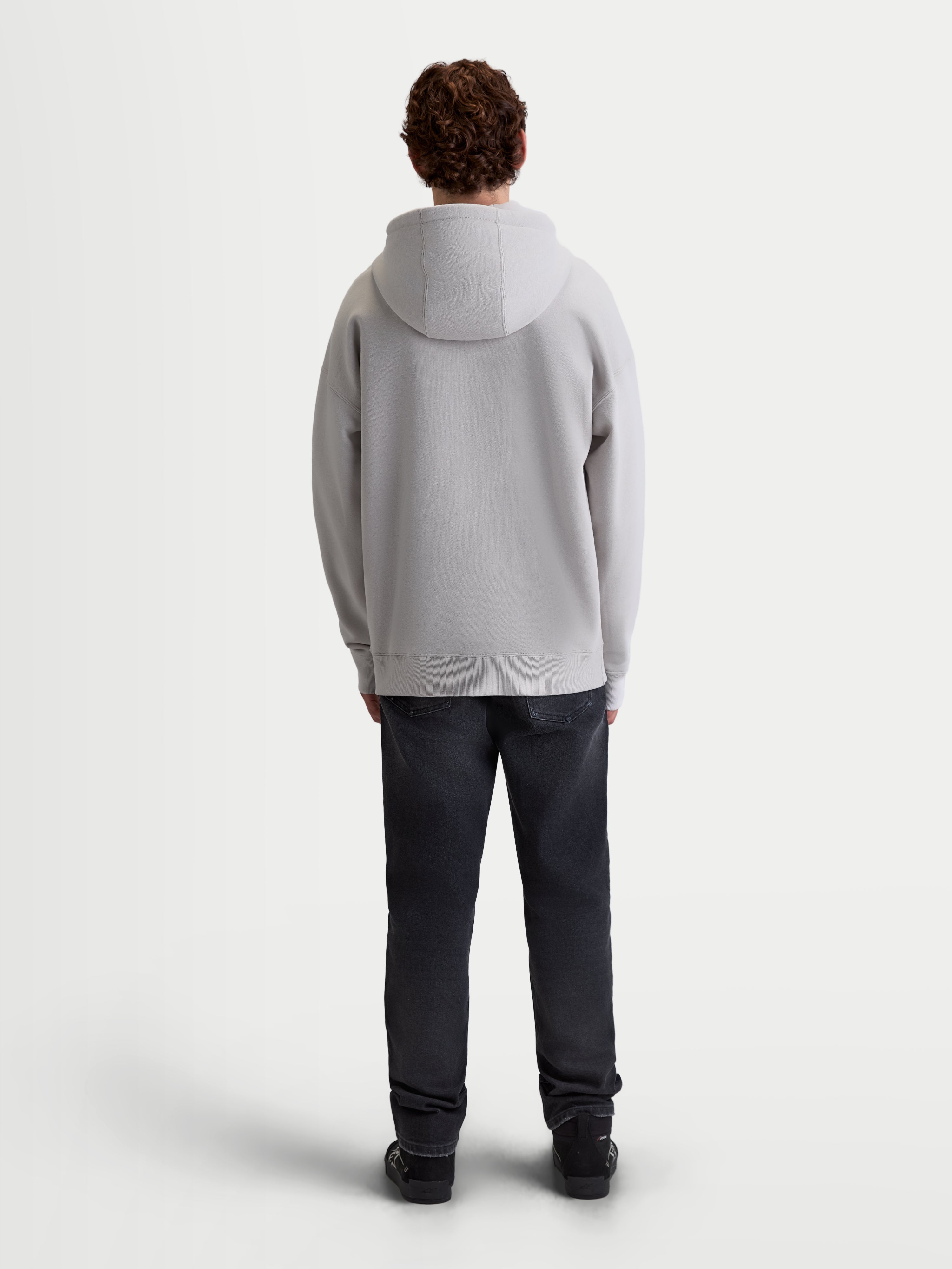 Alpinestars Entity Oversized Hoodie, Herren-Sportswear Kapuzenjacke, Cement Grau, Rückansicht mit lockerer Oversized-Passform, selbstgefütterter Kapuze und gerippten Saumdetails, Premium Lifestyle-Bekleidung.