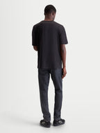 Alpinestars Infinity Oversized CSF T-Shirt, Kurzarm-Sportswear-T-Shirt für Herren, Schwarz, Rückansicht am Model, entspannte Passform für Off-Bike-Style und Alltagskomfort.