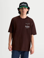 Alpinestars Post Oversized CSF T-Shirt, braunes Kurzarm-T-Shirt für Herren, Sportswear mit weißer Astars Wortlogo-Grafik und 'One Goal. One Vision.' Aufdruck auf der Brust, lockere Oversized-Passform für den Casual-Lifestyle.