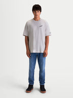 Alpinestars Mandate Oversized CSF T-Shirt, Herren Kurzarm-Sportswear-T-Shirt, Zementgrau, entspannte Oversized-Passform, schwarzer Astars-Logo-Puffdruck auf der Brust, Ärmelgrafik, Baumwoll-Polyester-Mix für Casual-Lifestyle.