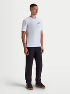 Alpinestars Combo Back CSF Tee, Short Sleeve Sportswear T-Shirt, White and Black, on-model front view featuring a small black Astars chest logo, premium cotton-poly blend fabric for everyday motorsport-inspired casual comfort.