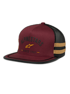 Alpinestars Backline Trucker Hat, kastanienbraune und schwarze Mesh-Kappe, gelbes Stern-Logo und „Since 1963“ Heritage-Grafik, strukturierte Krone mit flachem Schirm, senfgelbe Seitenstreifen