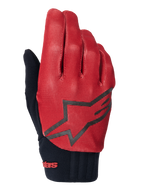 Alpinestars A-Dura Handschuhe, MTB-Handschuhe, Dunkelorange und Schwarz, Oberseite mit strukturiertem Gittermuster, großes schwarzes Stern-Logo, schwarzes Neoprenbündchen mit rotem Branding, entwickelt für Grip und Performance beim Mountainbiken
