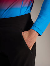 Black A-Dura Ride Pants detail showing a zippered side pocket, designed for durable mountain bike performance.
