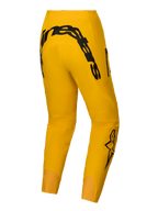 Alpinestars A-Supra Hose Melt Gold Limited Edition, Herren-Mountainbike-Hose in Dunkelgelb mit schwarzem Alpinestars-Schriftzug auf der Rückseite und 4-Wege-Stretchmaterial